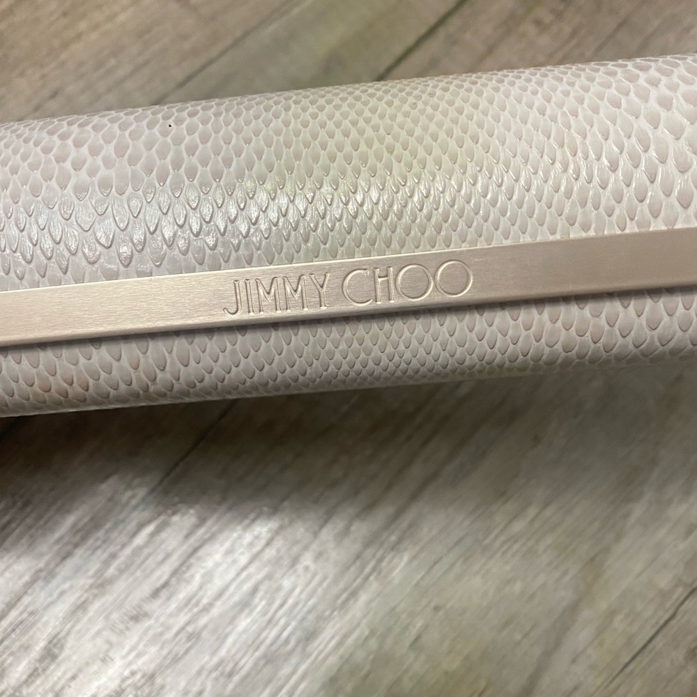 Jimmy Choo Ivory Snakeskin Hard Eyeglass Case with a magnetic closure.